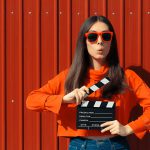 girl-with-clapboard girl with movie clapboard